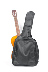 Naklejka premium Acoustic guitar in case on white background