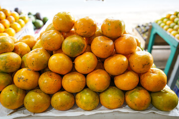 Indonesian local citrus fruit that tastes sweet and the color is a mixture of orange and green. This fruit is widely sold at a low price. This orange is not inferior in quality to imported oranges.