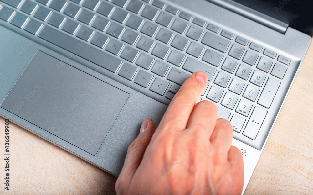 Poster man hand on laptop. using computer in work, study, online shopping, communication. digital technolog