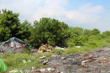 Homeless camp in a garbage dump