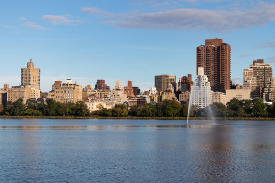 Central Park Reservoir and Fountain with the Upper East Side Skyline in New York City
