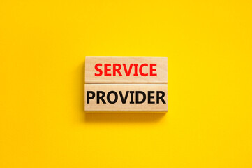 Service provider symbol. Concept words Service provider on wooden blocks on a beautiful yellow table yellow background. Business services and service provider concept, copy space.