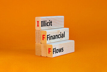 IFF illicit financial flows symbol. Concept words IFF illicit financial flows on blocks on a beautiful orange table, orange background. Business and IFF illicit financial flows concept. Copy space.