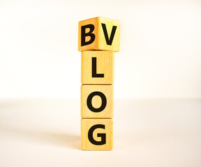 Blog or Vlog symbol. Turned a wooden cube and changed the word Blog to Vlog. Beautiful white table...