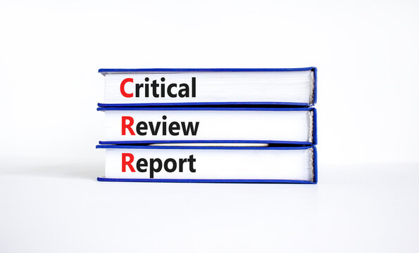 CRR critical review report symbol. Concept words CRR critical review report on books on a beautiful white table, white background. Business and CRR critical review report concept. Copy space.