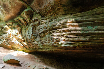 Tall rock formation with green moss in Hocking Hills State Park © MeganKobe