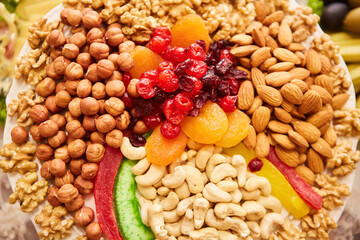 There are many different types of nuts lies in the dish