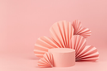 Tender pastel pink stage mockup with paper hearts and single round podium for presentation cosmetic product, advertising, design on soft light background, copy space. Valentines day scene template.