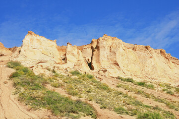 Fototapeta premium Cliffs by the beach of Pacific ocean. Puerto Santa Cruz.