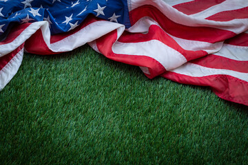 Grass sports field and American Flag viewed from above