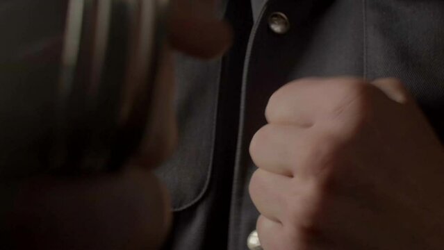 Striking blow with the fist, close-up. Punch combat. Using brass knuckles as a melee weapon. Threats should be considered violent if they involve a risk of the use of physical force.