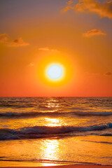 Fototapeta na wymiar Hypnotic sunset with a pronounced sun at its zenith