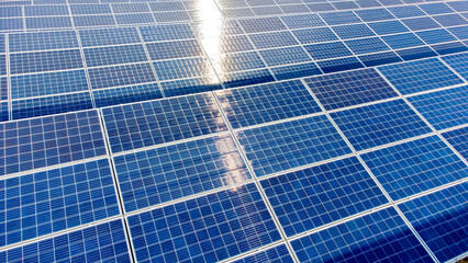Aerial drone view flight over solar panels on sunny day close-up. Photovoltaic solar panel. Moving...