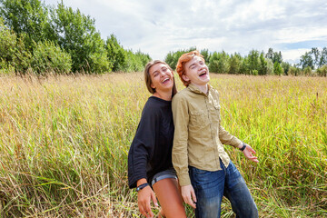 Summer holidays vacation happy people concept. Loving couple having fun together in nature outdoors. Happy young man dancing hugging with his girlfriend. Happy loving couple outdoor at summertime