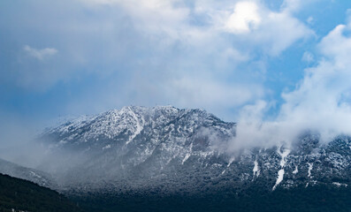 Plakat Foggy Snowy Mountains. Magical atmosphere of a foggy morning in a mountain. Copy paste banner space.