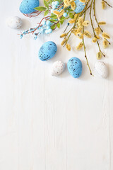 Willow branches and decorations, easter eggs on a light background. Happy easter flat lay concept