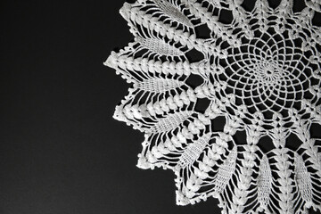 handmade white vintage lace on black with copy space. May be used as background