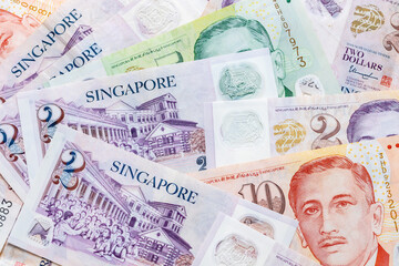 Singapore dollars, scattered money, various banknotes, business and economic background