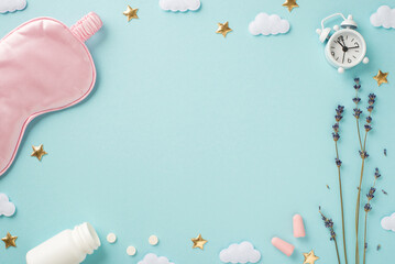 Top view photo of pink satin sleeping mask lavender alarm clock earplugs open bottle with pills clouds and golden stars on isolated pastel blue background with blank space in the middle