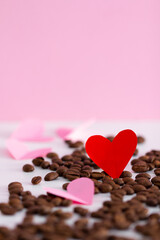 Hearts and coffee beans on pink background