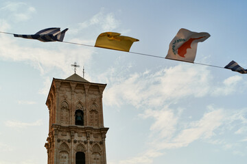 Tower in Cyprus city with flags