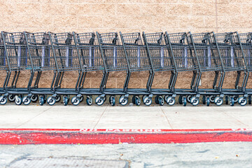 row of shopping carts at supermarket