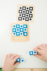 cubes for logical tasks. A tool for the child's perception, concentration, logical and analytical thinking. Implement for measuring a child's intelligence, training patience, maintenance of attention