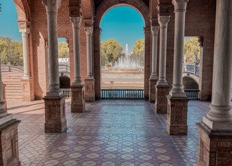 Obraz na płótnie Canvas Seville, Spain: 03-07-2021: Seville Sevilla Plaza de Espana in Andalusia Spain square. is a square in the Parque de Maria Luisa, Historical landmark. Arabic ceramic style. 