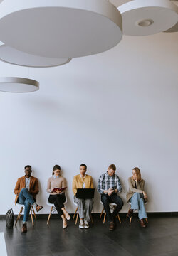 Group of bored people waiting for the job interview
