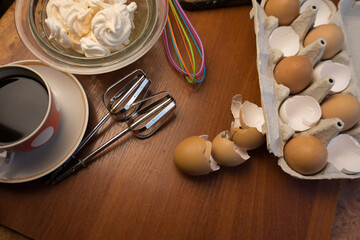 Delicious crispy homemade egg meringue, prepared with love on a wooden background, crunchy dessert...