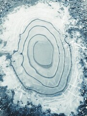 drawing of circles on ice. Cracked. mobile photo