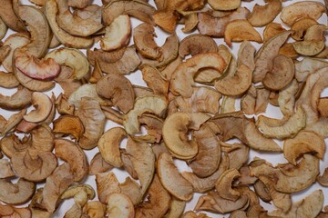Dried apple slices on a white background. Dried fruits.