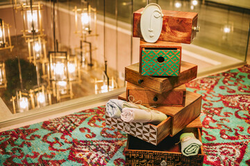 Creative product shot of rolled towels with modern wooden ornaments in luxurious hotel