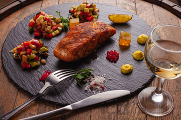 Molecular cuisine and grilled red fish on a stone substrate