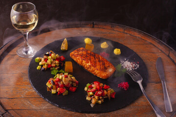 Molecular cuisine and grilled red fish on a stone substrate
