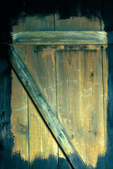 Naklejka na ściany i meble doors made of old boards, damaged by worms