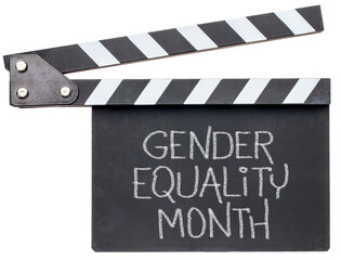 Naklejka premium Gender Equality Month - white chalk handwriting on a clapboard, reminder of annual monthly event and global initiative to empower women and girls