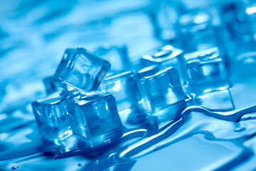 Frosty ice cubes background in blue tone