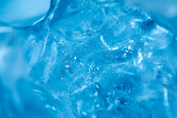 Fototapeta na wymiar Frosty ice cubes background in blue tone