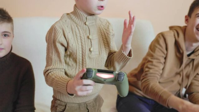 children playing on the console with joysticks in ruhs close-up