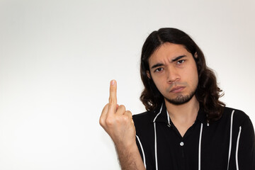 portrait of a very angry, furious and upset hispanic man on a white background