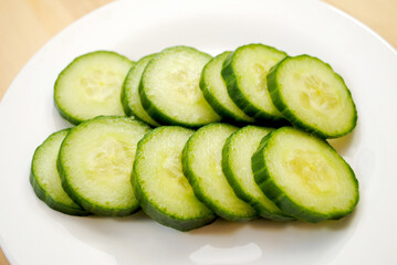 Burpless Cucumber Slices on a White Plate