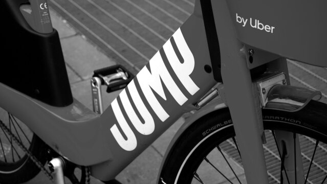 Rome, Italy - October 27, 2019: JUMP Logo On Red Bicycles UBER. Bike Sharing Service Integrated Into The App Of The Company Founded In San Francisco By Travis Kalanick In 2009