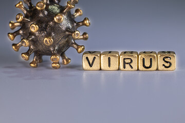 Strong angry virus with a face. The coronavirus is slightly blurred. A type of virus made of metal