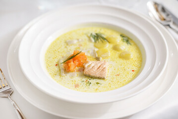 Fish soup with salmon, potatoes and cream