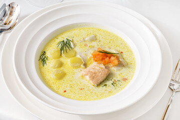 Fish soup with salmon, potatoes and cream