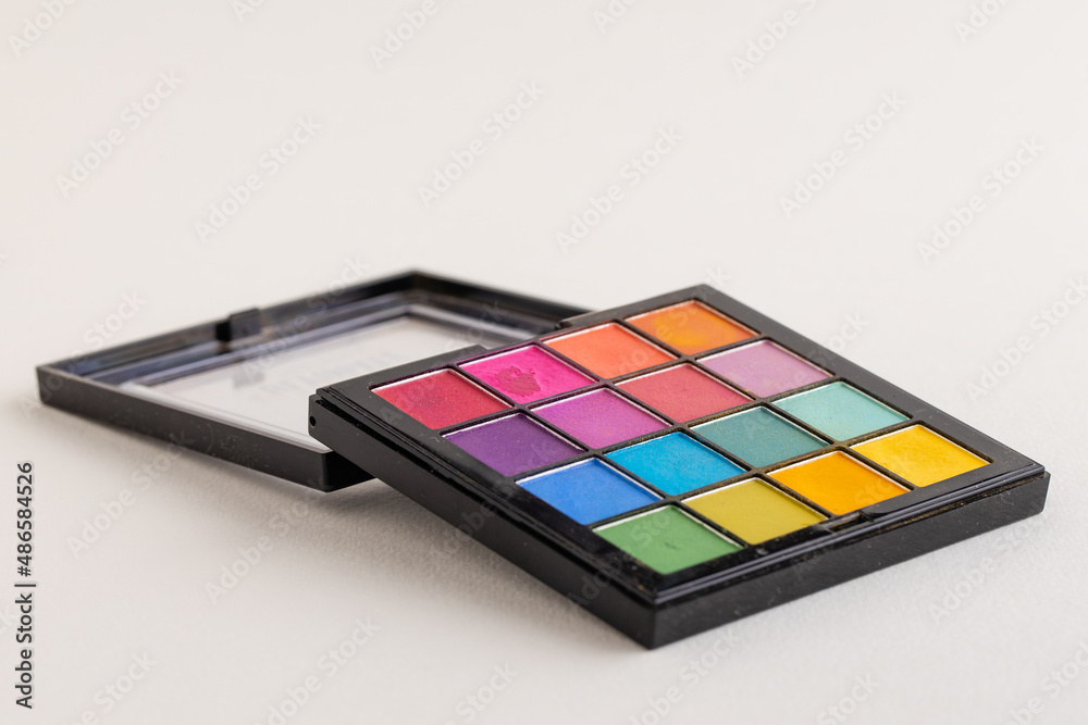 Wall mural Palette of multicolored eyeshadows, close-up