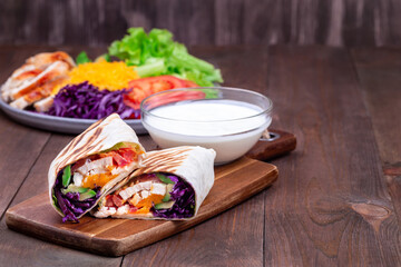 Grilled chicken wraps, horizontal, copy space