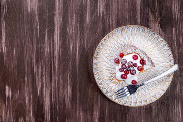 Piece of Swedish saffron Kladdkaka pie, horizontal, top view, copy space