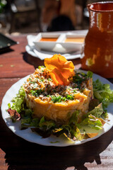 Dinner at guachinche, typical Canary Island establishment on Tenerife, where locally produced white or red wine served accompanied by homemade traditional food, sweet potato salad